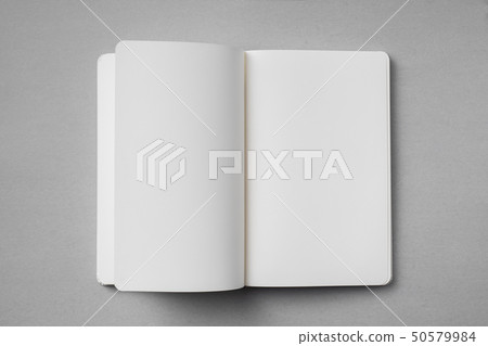 white notebook with turn page on grey background white notebook with turn page on grey background 50579984