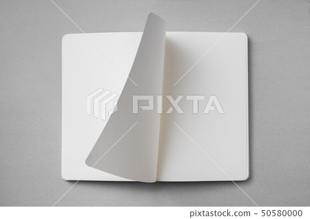 white notebook with turn page on grey background white notebook with turn page on grey background 50580000