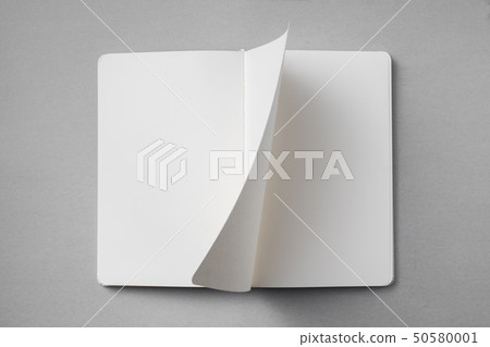 white notebook with turn page on grey background white notebook with turn page on grey background 50580001