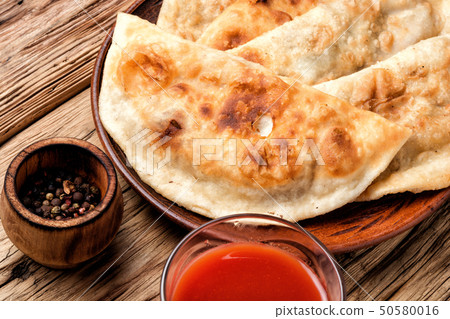 Cheburek,dough pie with meat filling Cheburek,dough pie with meat filling 50580016