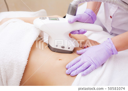 Body Care. Woman is in the process at the clinic lipomassage 50581074