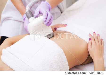 Body Care. Woman is in the process at the clinic lipomassage 50581076