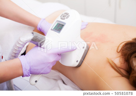 Body Care. Woman is in the process at the clinic lipomassage 50581078