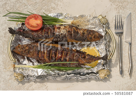 smoked scomber on a tray with foil smoked scomber on a tray with foil 50581087