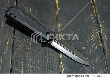 Knife in the form of a spear. Diagonal position. Knife in the form of a spear. Diagonal position. 50583189