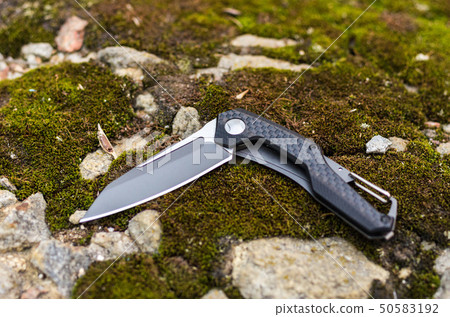 Pocket knife in a curved state. 50583192