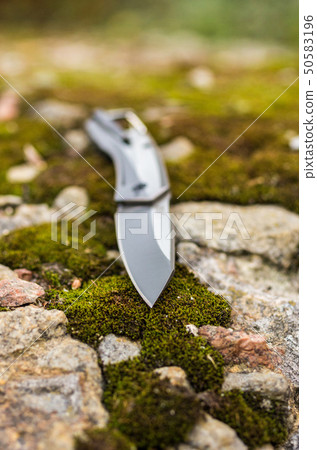 The knife is inclined. Photo knife in nature. 50583196