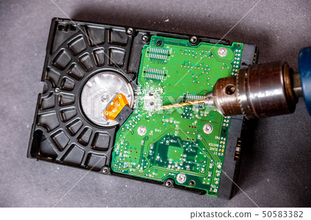 Concept of deleting big data by drilling a hole into the harddisk 50583382