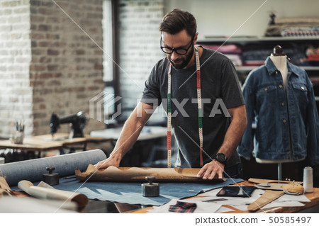 Fashion designer working in his studio 50585497