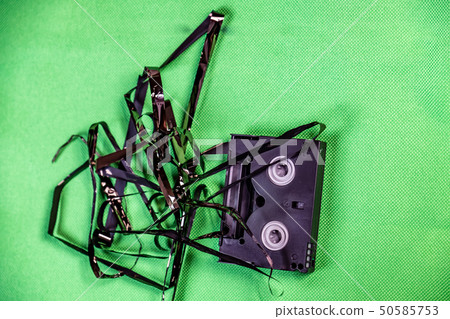 Tape pulled out from mini dv format video cassette tape 50585753