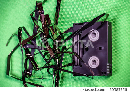 Tape pulled out from mini dv format video cassette tape 50585756
