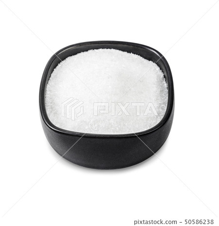 Monosodium glutamate in black bowl. 50586238