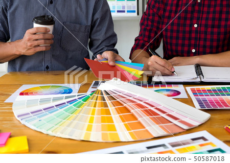 Graphic designers choose colors bands samples. 50587018