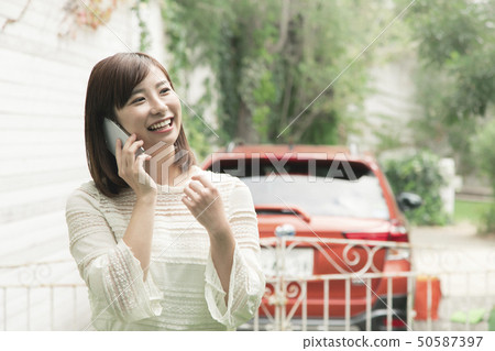 Woman using a smartphone 50587397