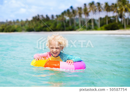 Child on tropical beach. Sea vacation with kids. Child on tropical beach. Sea vacation with kids. 50587754