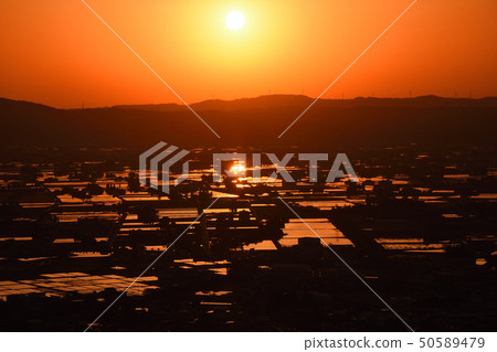 A scattered village and sunset A scattered village and sunset 50589479
