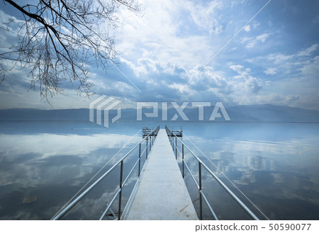 Metal pier on the lake Metal pier on the lake 50590077