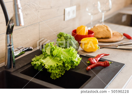 Fresh vegetables for salad on a kitchen table. Natural organic healthy food Fresh vegetables for salad on a kitchen table. Natural organic healthy food 50590228