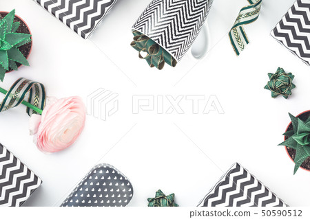Black and white chevron gift boxes with green bows Black and white chevron gift boxes with green bows 50590512