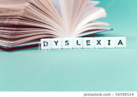 Dyslexia word with an open book Dyslexia word with an open book 50590524