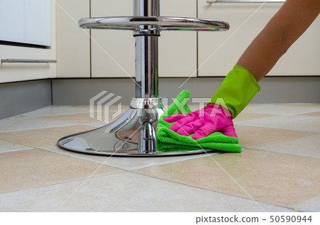 Hand polishing in a kitchen 50590944