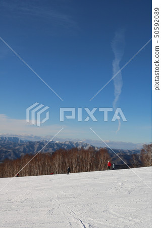 Slope and contrail 50592089