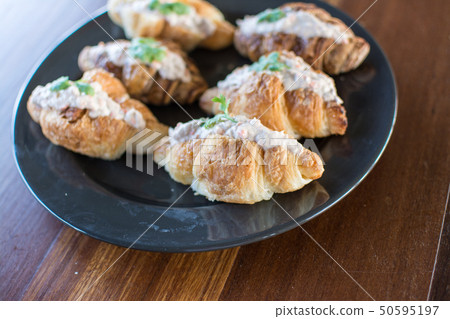 Croissant with Tuna Salad  Sandwich on wood table 50595197