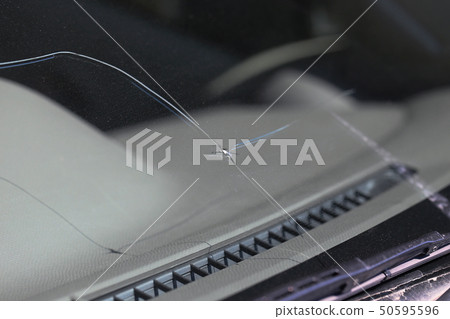 Damage to car windshield by stepping stones Damage to car windshield by stepping stones 50595596