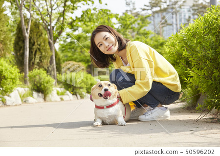 Wellness, puppy, walking, young woman 50596202