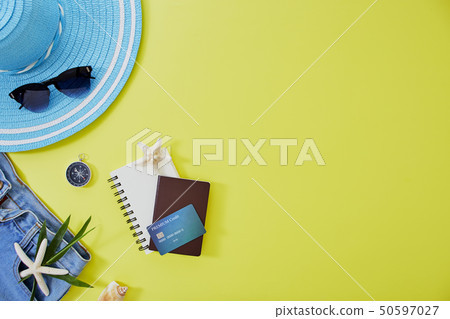 Flat lay yellow summer travel concept background Flat lay yellow summer travel concept background 50597027