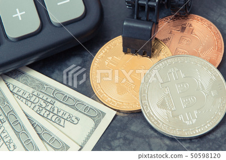Bitcoin coins, calculator, dollar 50598120