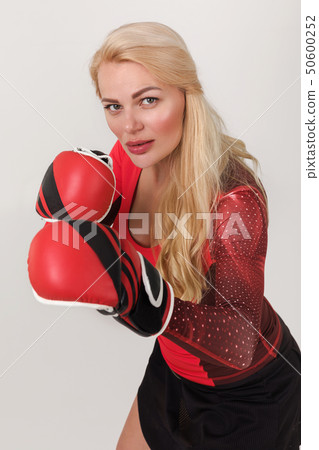 athlete woman posing in boxing gloves athlete woman posing in boxing gloves 50600252