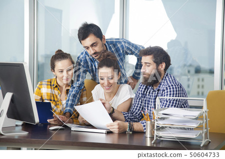 Young proffessional team working together in the Young proffessional team working together in the 50604733