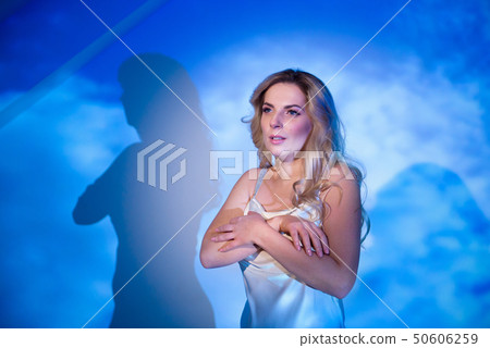 Beautiful, sexy female model on a blue and white 50606259