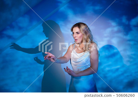 Beautiful, sexy female model on a blue and white 50606260