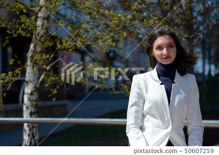 Beautyful brunette woman. Modern urban woman portrait. Fashion business style clothes. Beautyful brunette woman. Modern urban woman portrait. Fashion business style clothes. 50607259