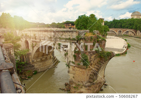 Ruins Bridge over the Tiber River in Rome, Italy. Ruins Bridge over the Tiber River in Rome, Italy. 50608267