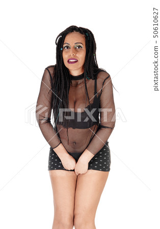 Young woman standing in shorts must pee 50610627
