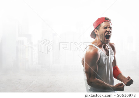The athlete in the red baseball cap screams The athlete in the red baseball cap screams 50610978