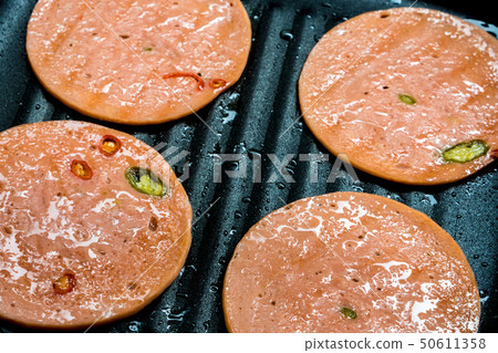 Spices Bologna fried in pan Spices Bologna fried in pan 50611358