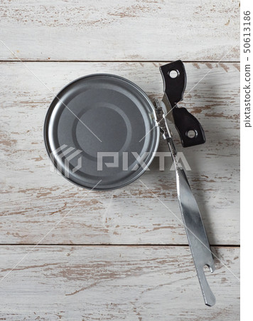 Canning knife opens the jar. Top view. Canning knife opens the jar. Top view. 50613186