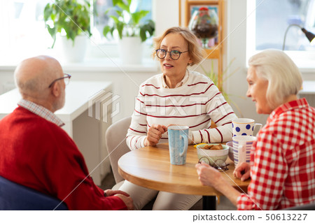 Pleasant aged people having delicious tea together Pleasant aged people having delicious tea together 50613227
