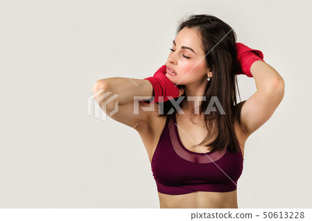beautiful woman boxer with red strap on wrist. beautiful woman boxer with red strap on wrist. 50613228
