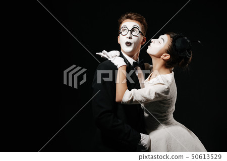 portrait of couple mime on black background. 50613529
