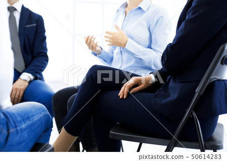 Group of people sitting in a circle during therapy. Meeting of business team participating in Group of people sitting in a circle during therapy. Meeting of business team participating in 50614283