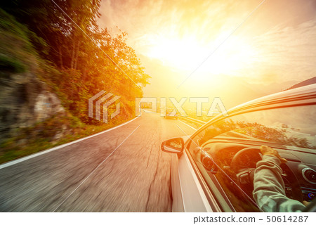 Car in motion blur driving in the Mountains 50614287