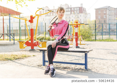 portrait of a woman with tennis racket 50614416