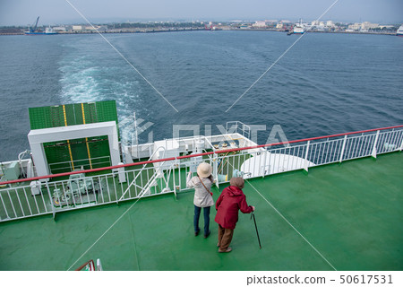 Tsugaru Strait Ferry just after leaving Aomori Port Mother and daughter looking at the shore of Blue Dolphin 50617531