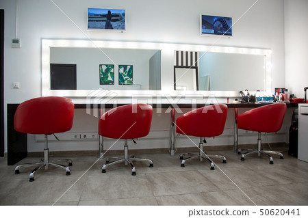 Bright dressing room with red chairs. a simple room for make-up several comfortable chairs are in a Bright dressing room with red chairs. a simple room for make-up several comfortable chairs are in a 50620441