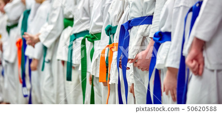 Concept karate, martial arts. Construction of students in the hall before training. Kimono Concept karate, martial arts. Construction of students in the hall before training. Kimono 50620588